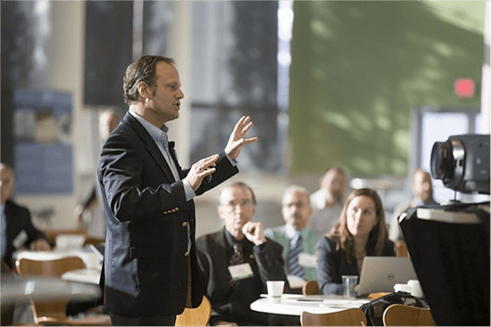 Man presenting to group of people